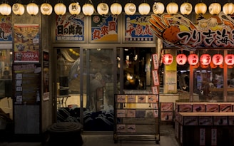 a store front at night with lights on