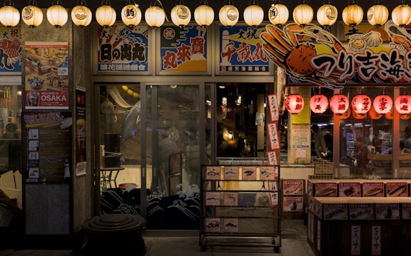 a store front at night with lights on