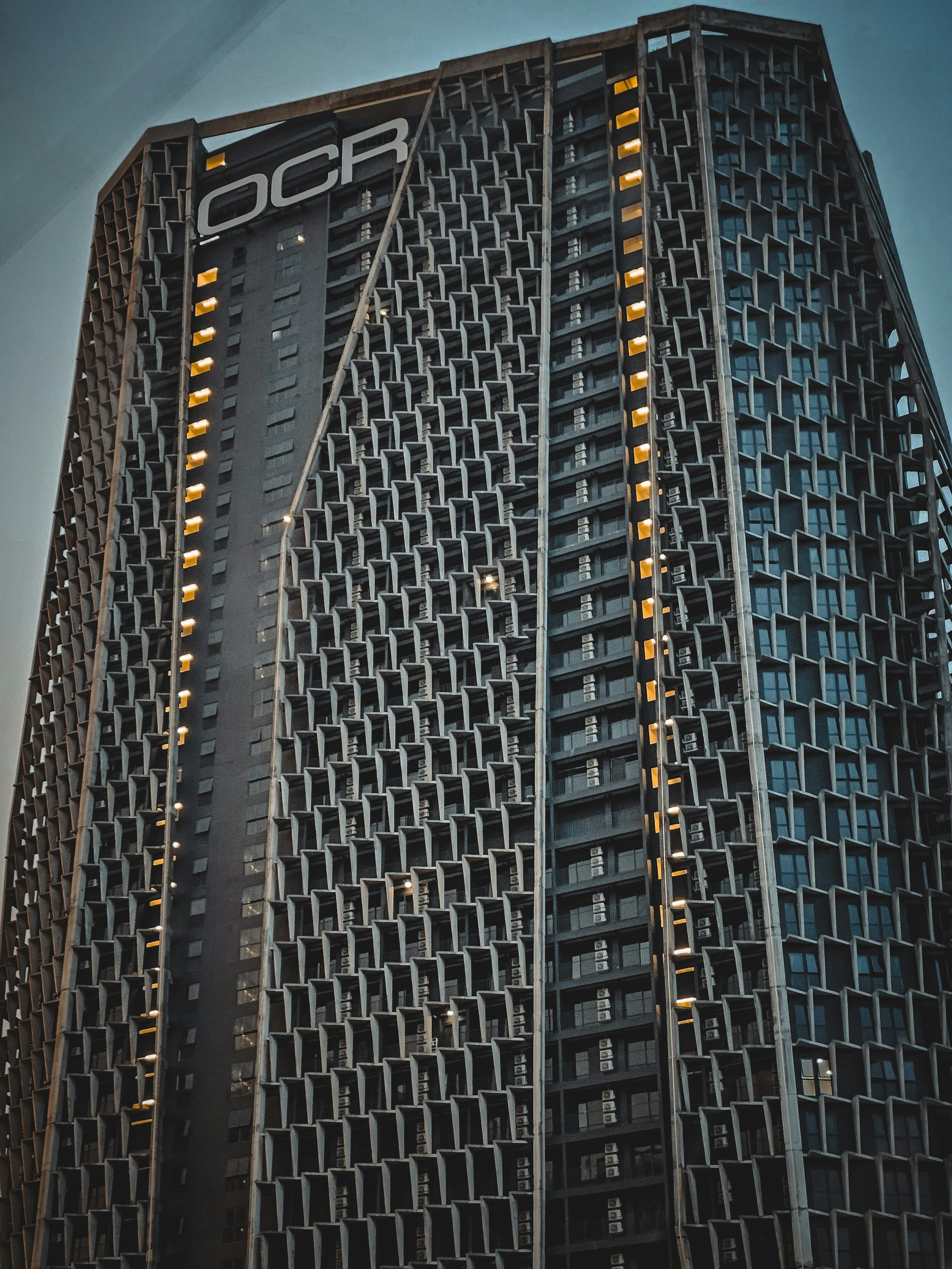 a very tall building with a clock on it's side