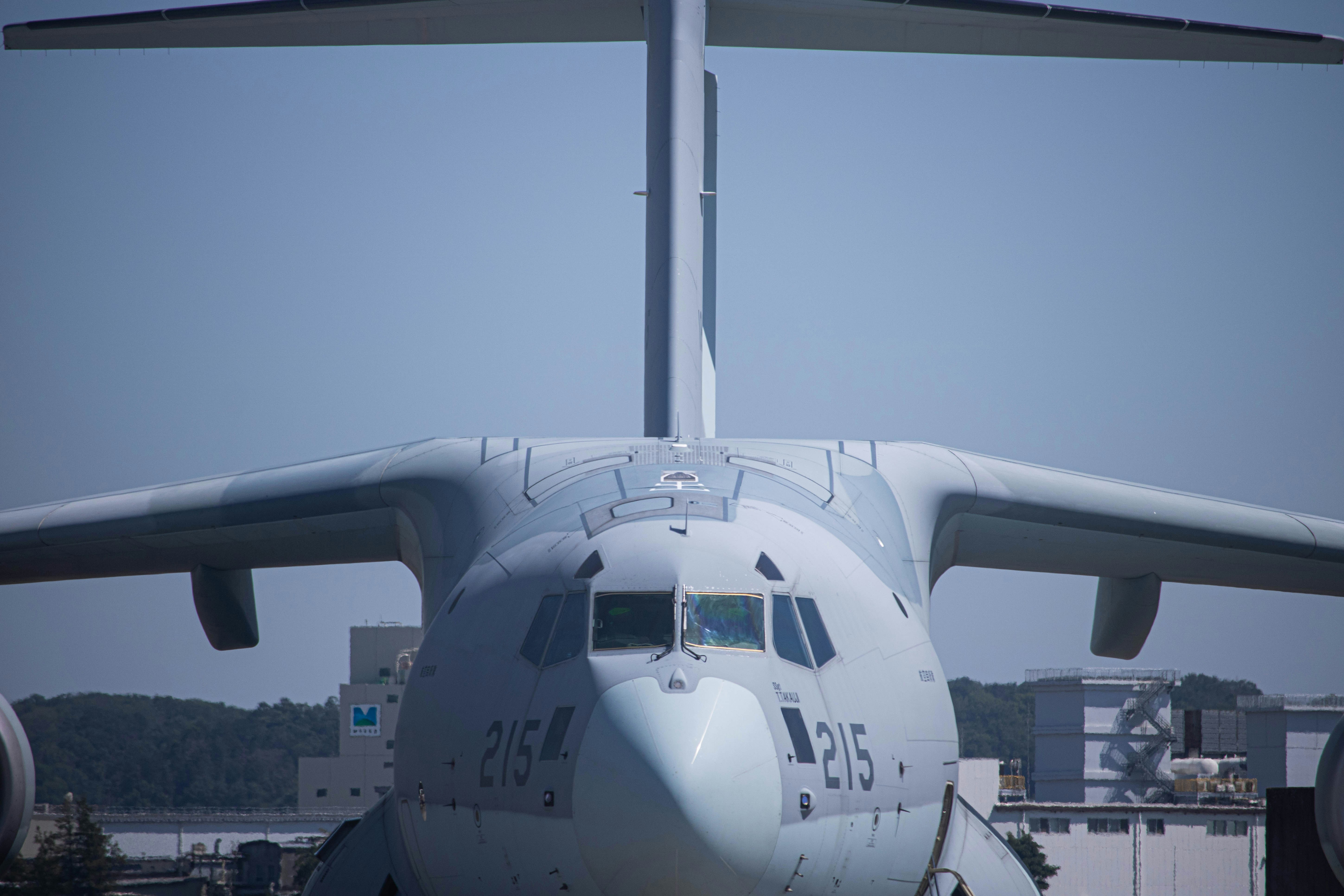 a large jetliner sitting on top of an airport tarmac, 