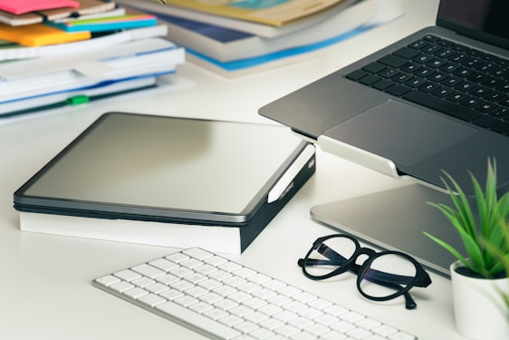 a laptop cmputer sitting on top of a white desk