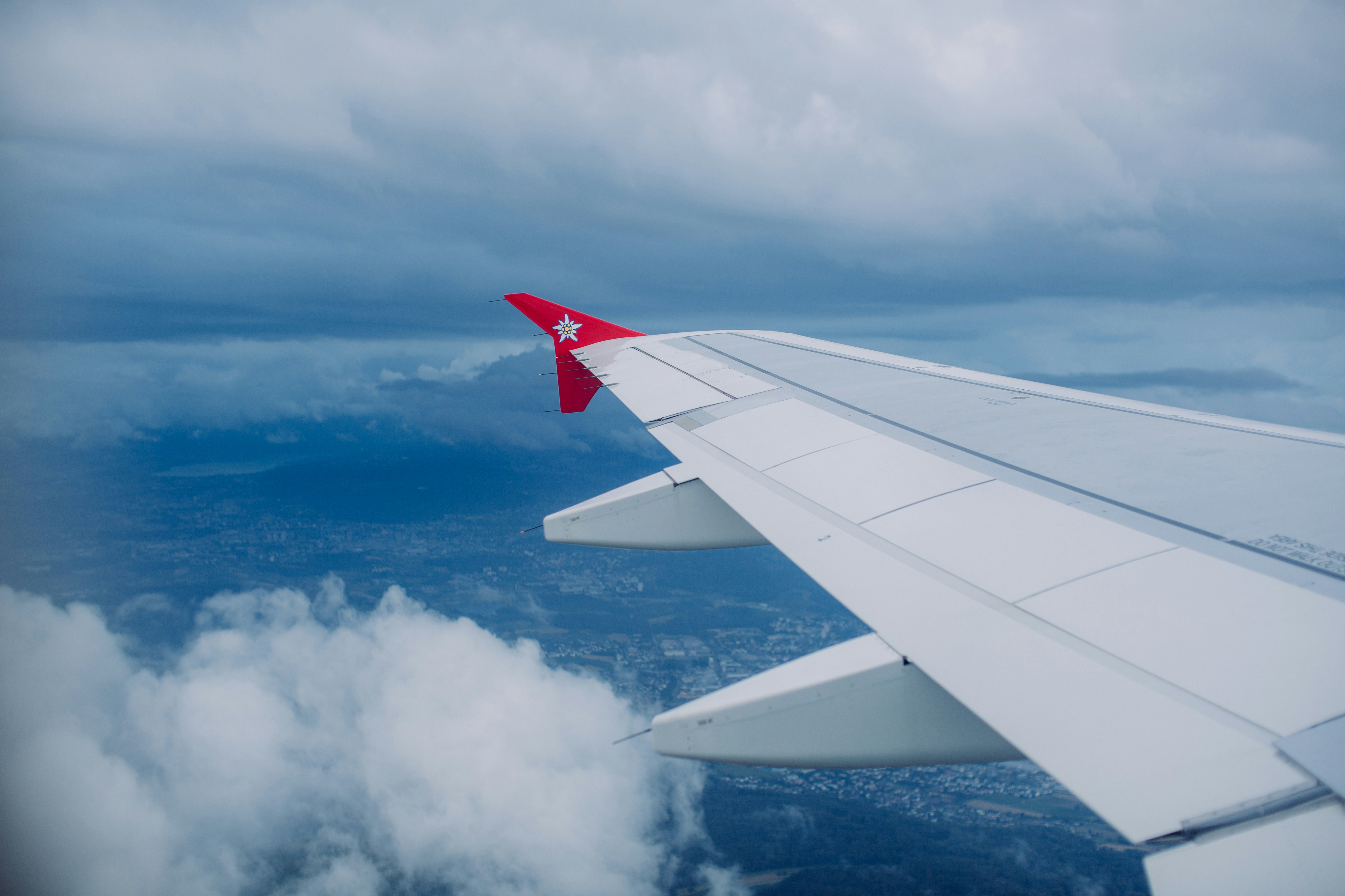a view of the wing of an airplane in the sky, 