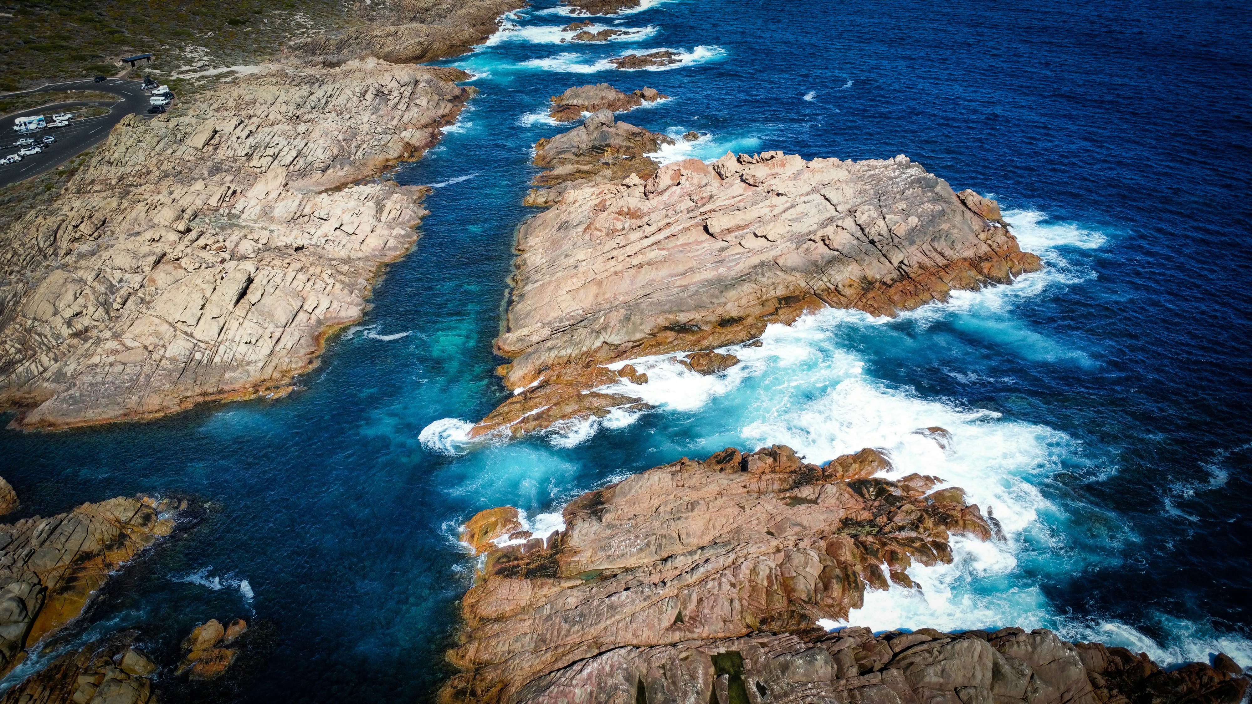 a large body of water surrounded by rocky coastline