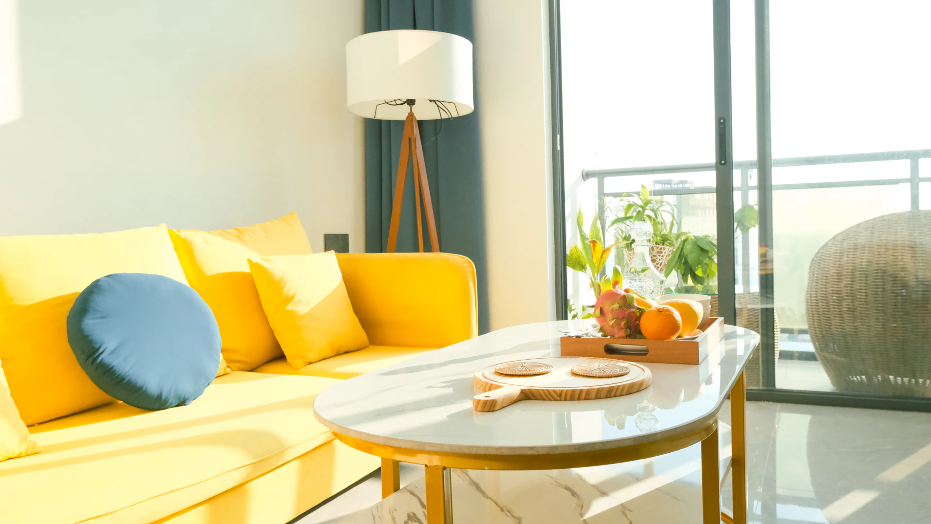 a living room filled with furniture and a large window