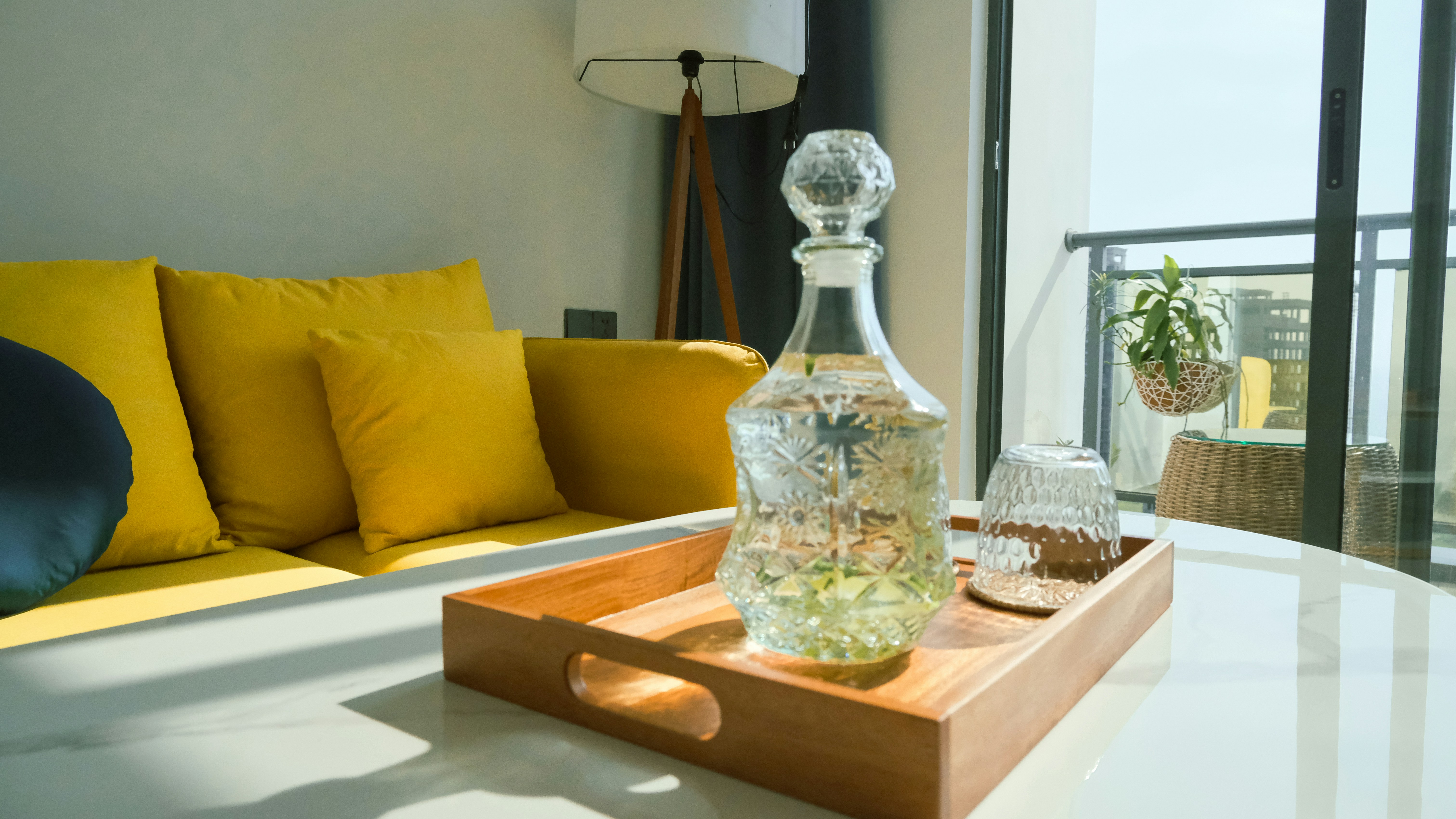 a glass bottle on a tray on a table