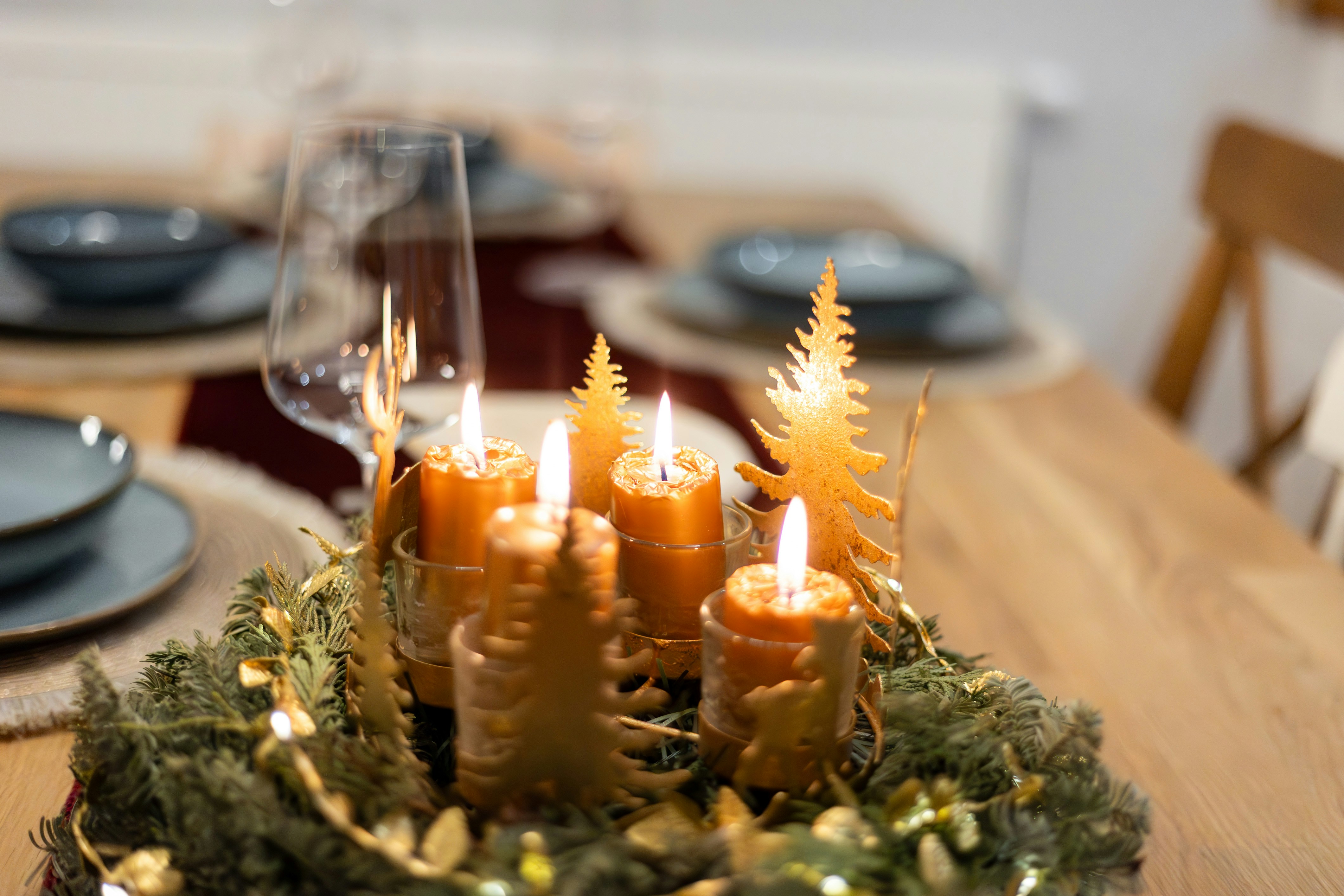 a wooden table topped with lots of candles