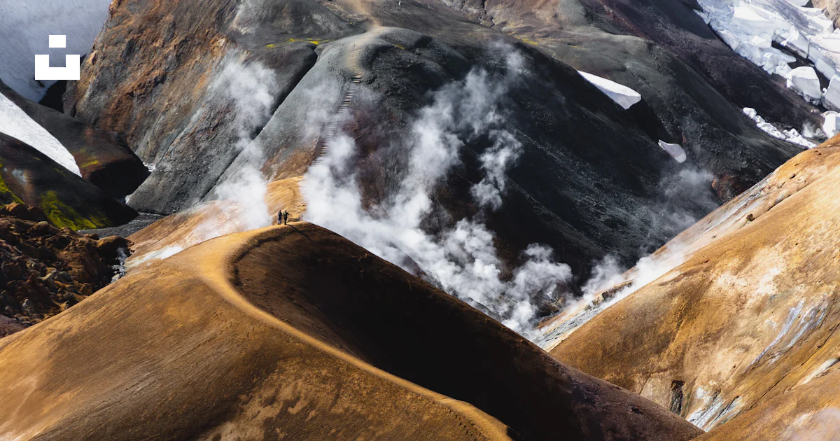 Steam rises from the ground near a mountain photo – Free Nature Image ...
