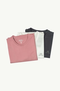 three t - shirts in different colors on a white background