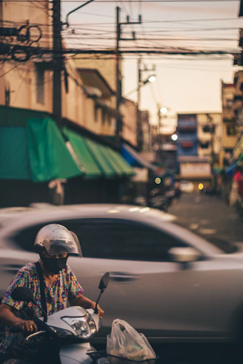 a person riding a motorcycle on a city street