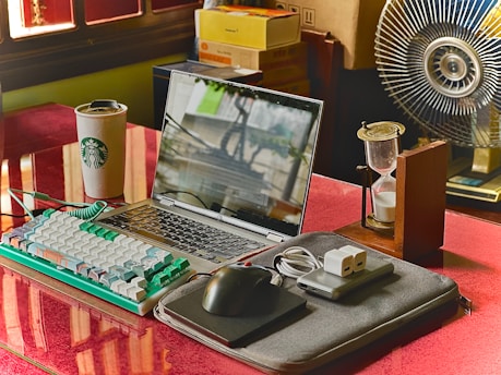 A laptop computer sitting on top of a desk