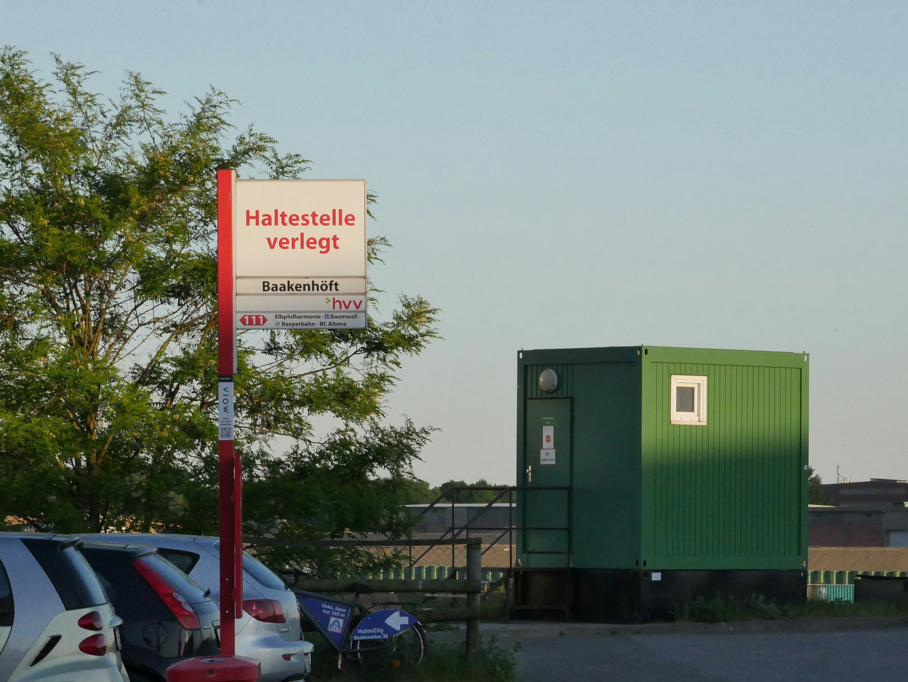 a sign that is in front of some cars