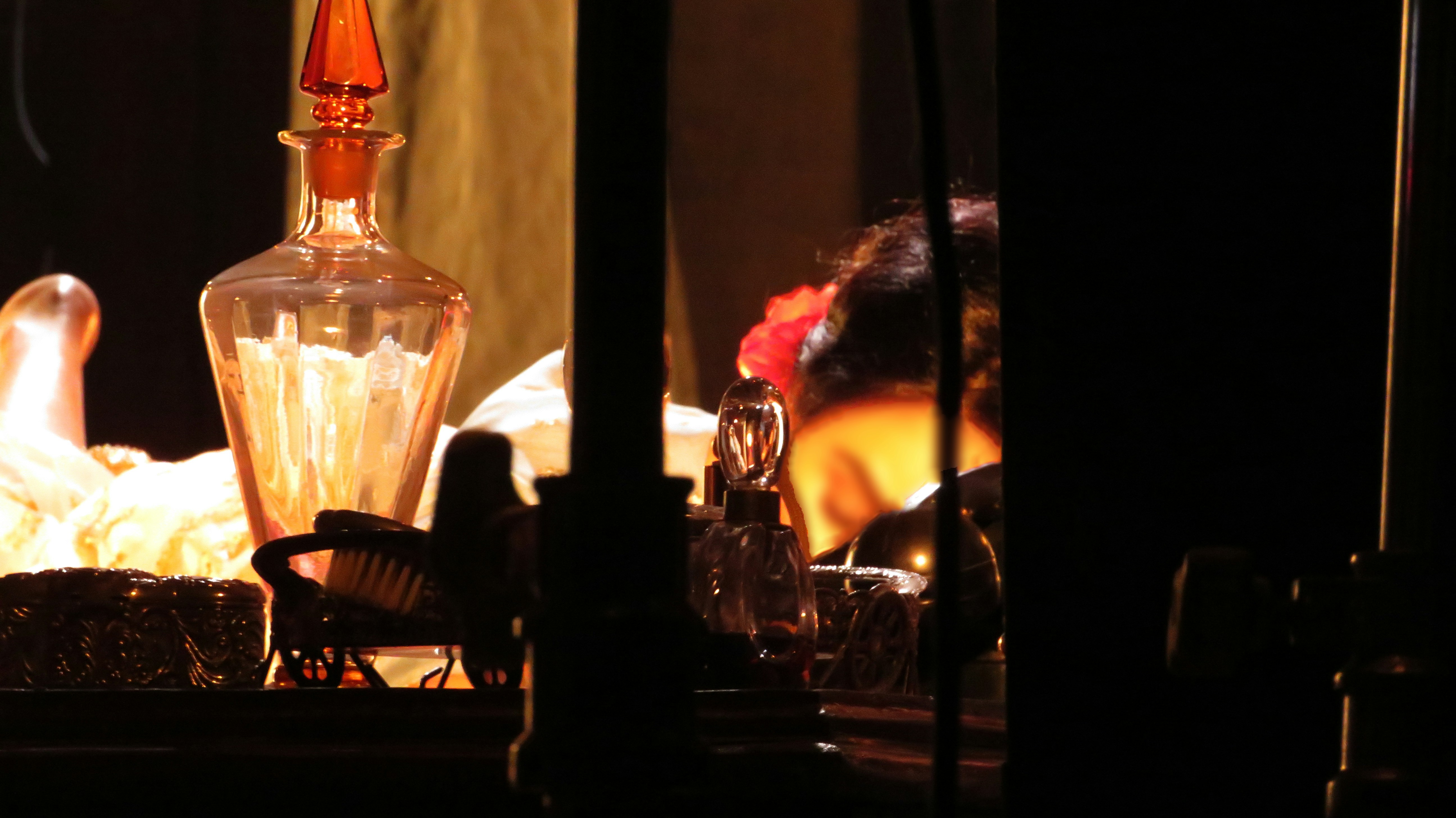 a bottle of perfume sitting on top of a table