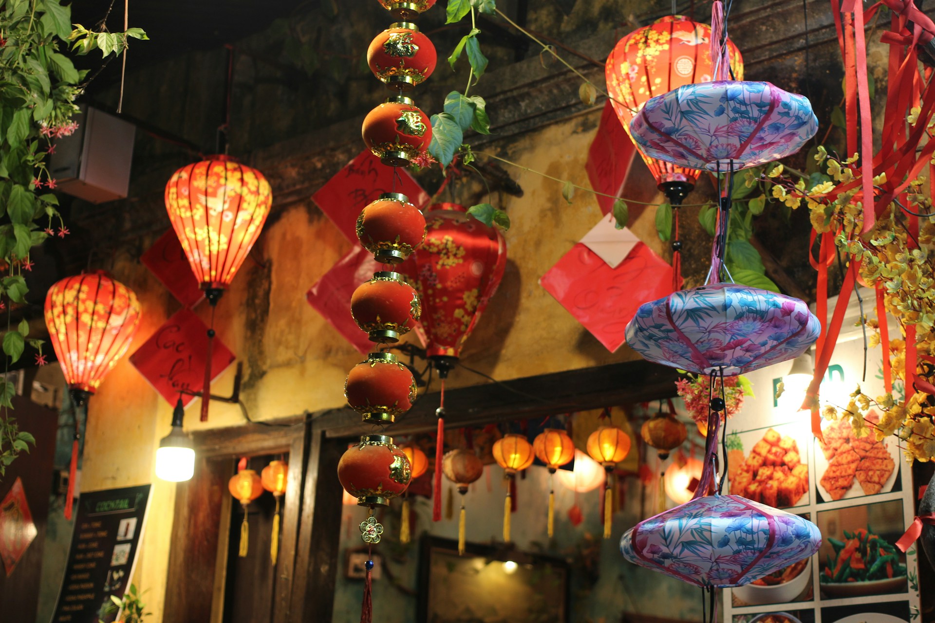 a number of lanterns hanging from a ceiling
