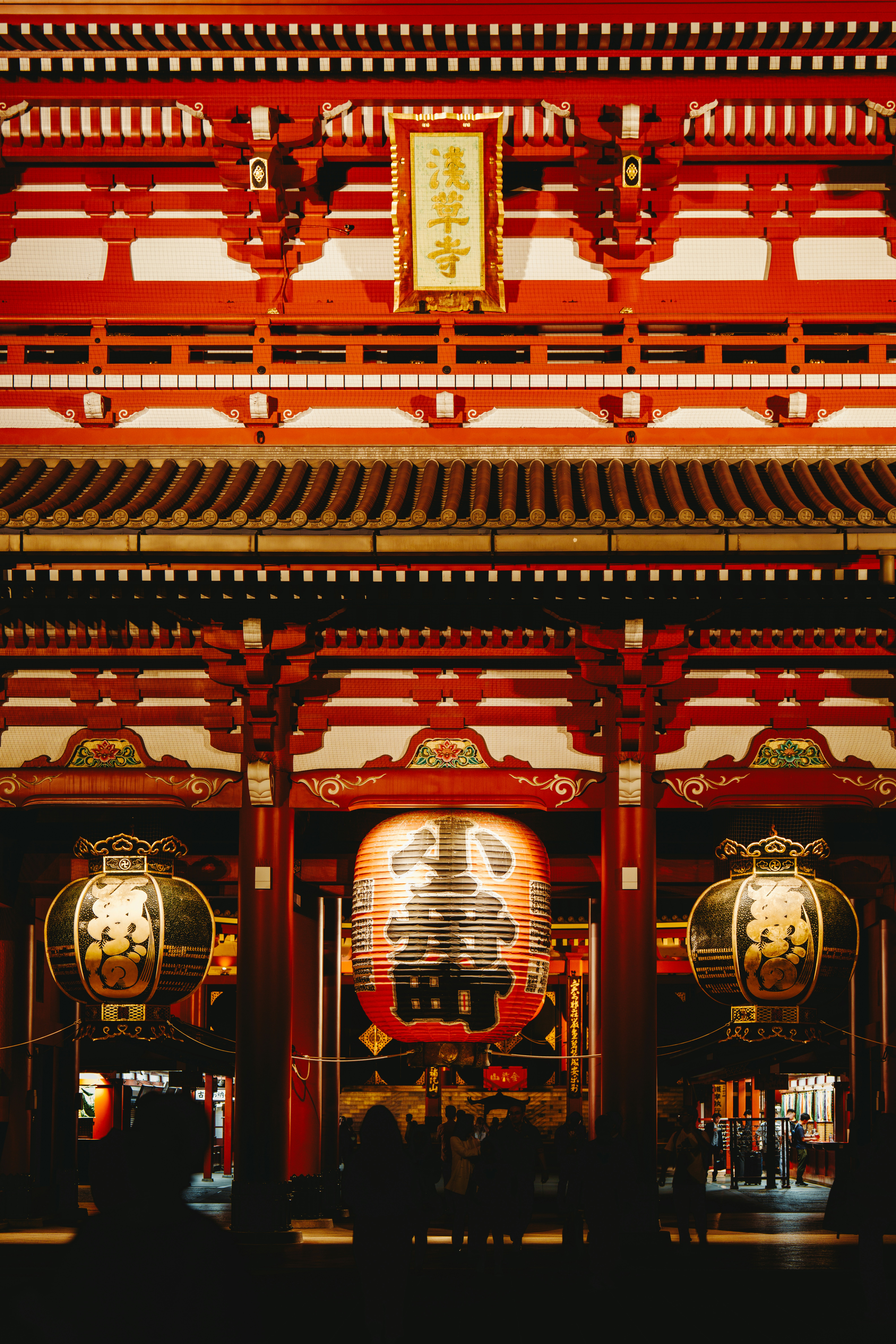 a red building with a clock on the front of it