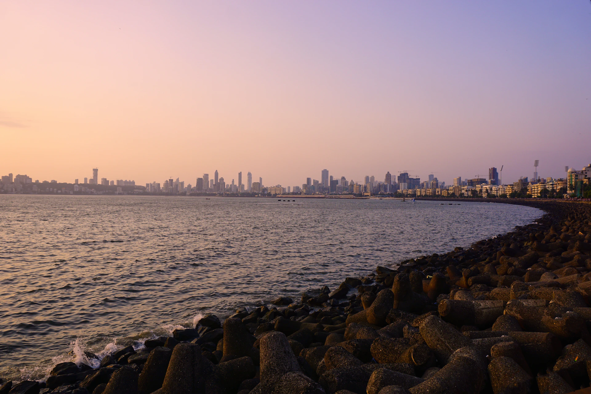a body of water with a city in the background