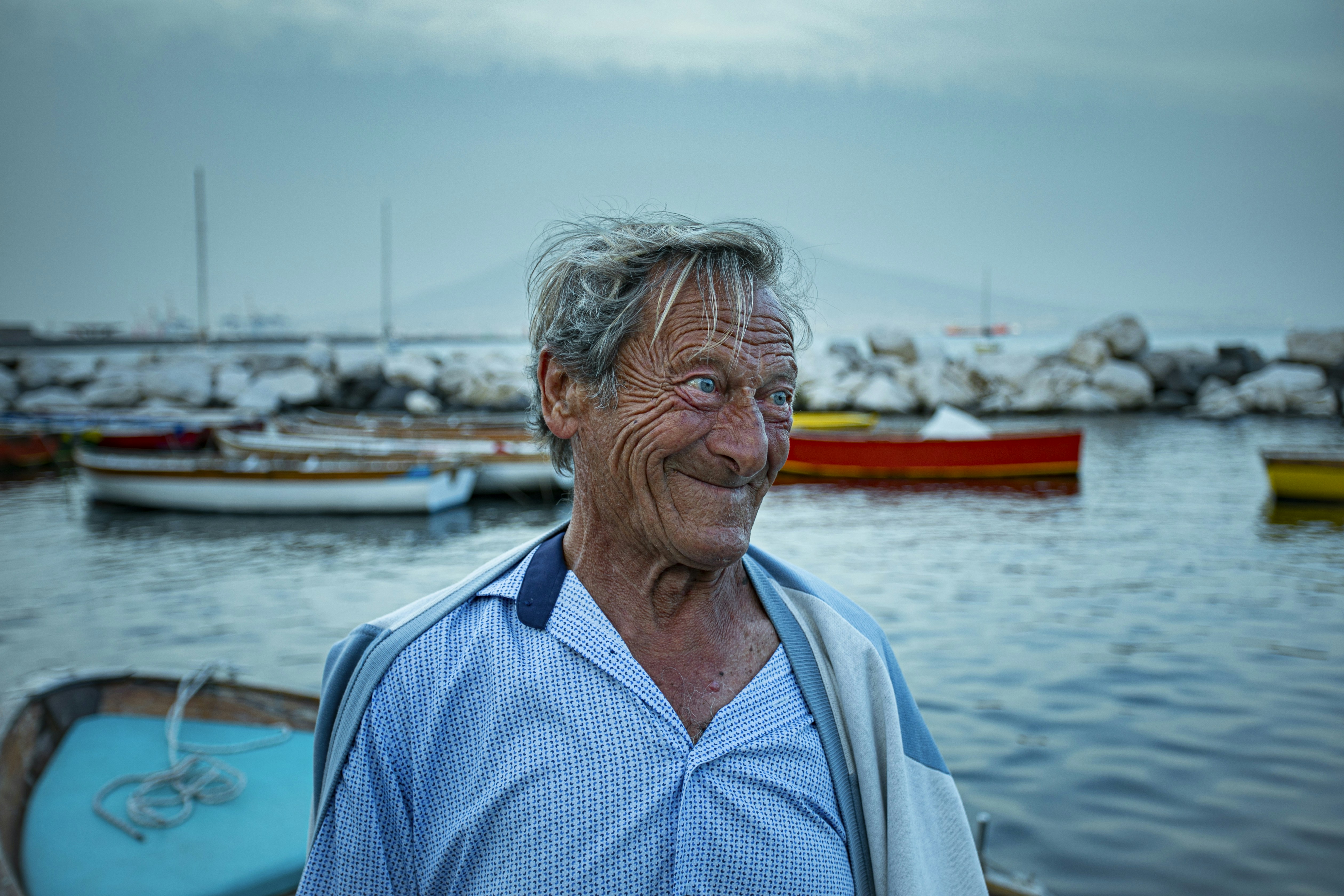 a man standing in front of a body of water