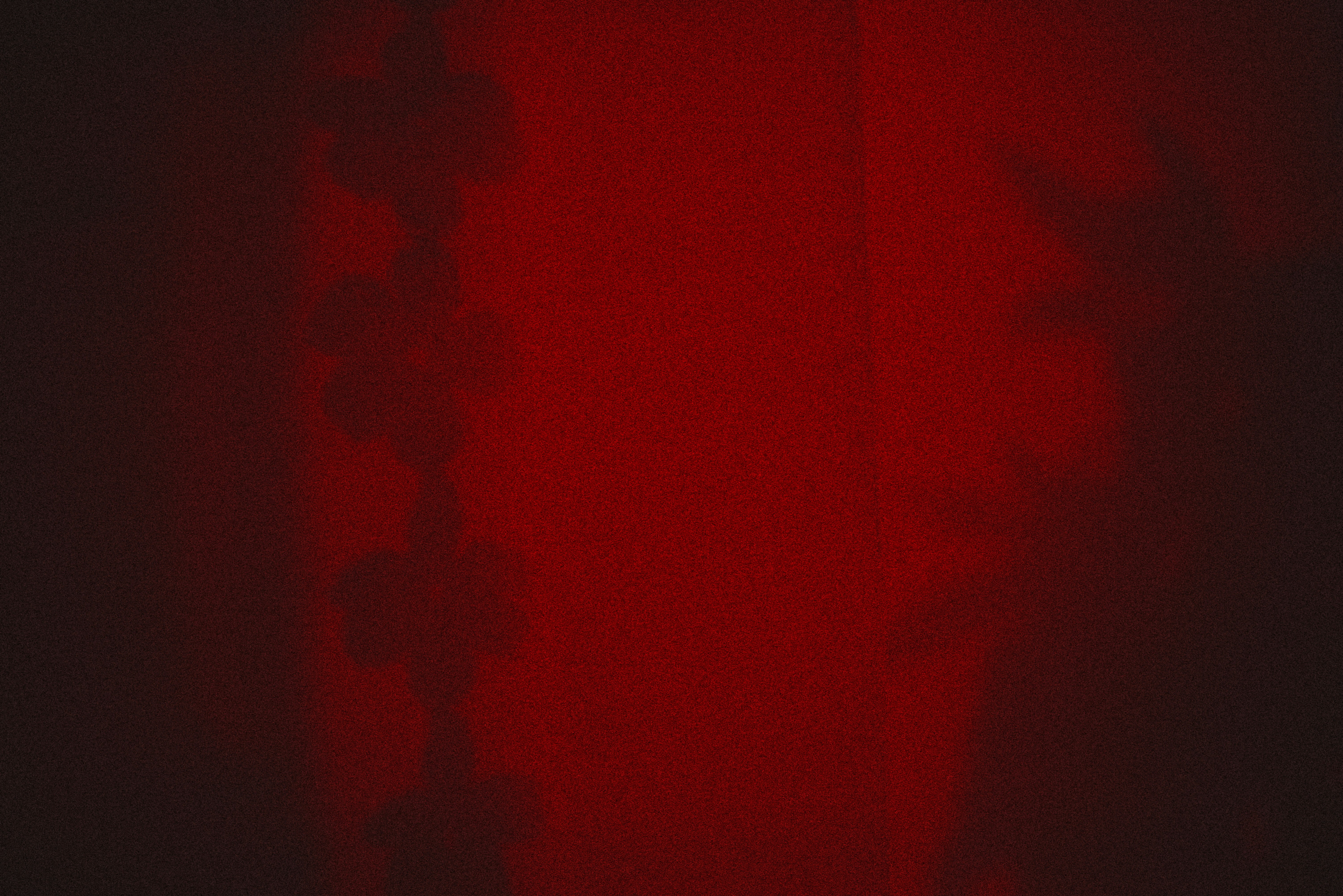 A close-up of a golden-brown brioche donut being lifted out of the frying oil