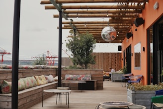 a patio with a lot of seating and tables