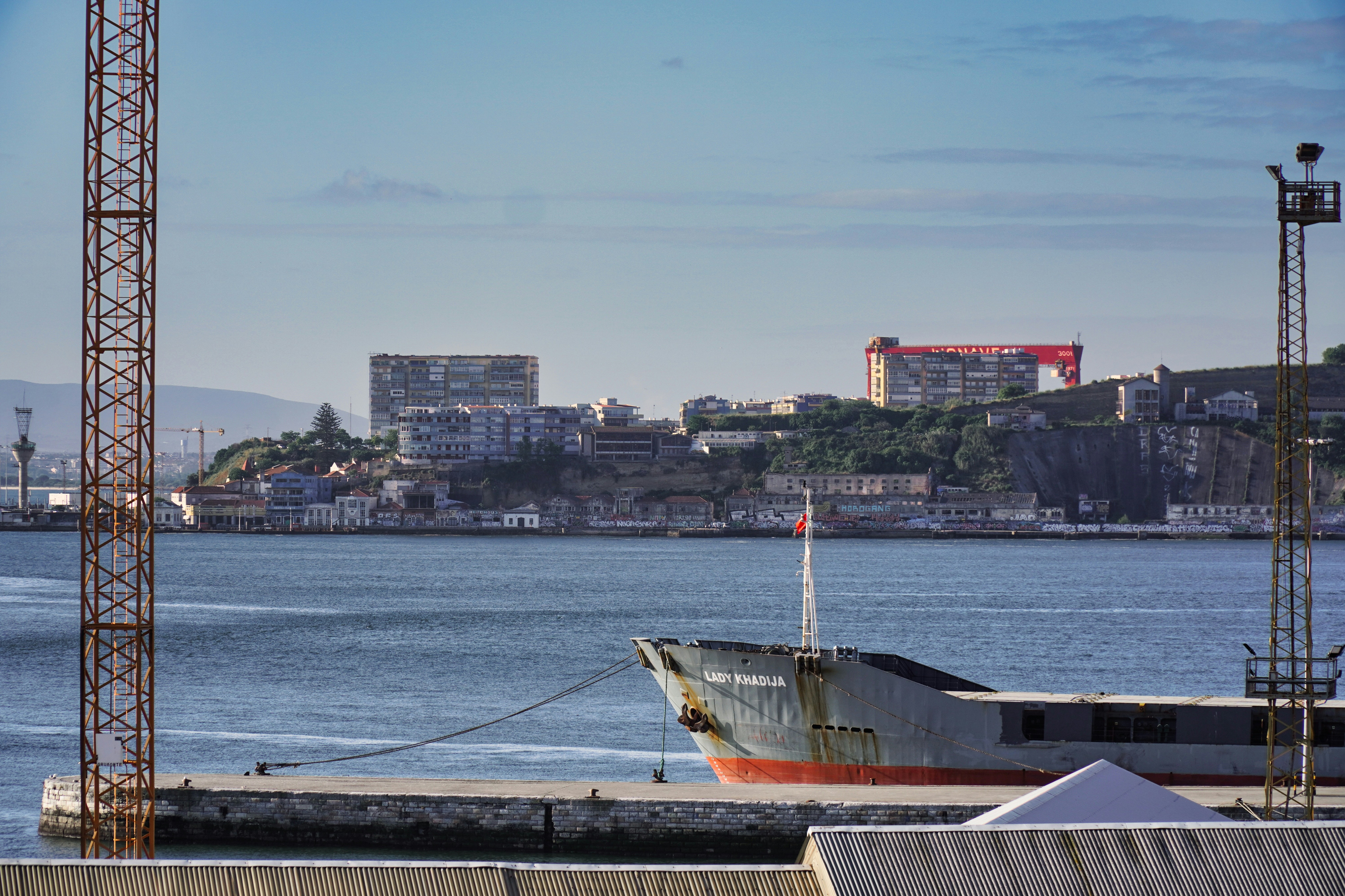 a boat is docked at a dock in the water