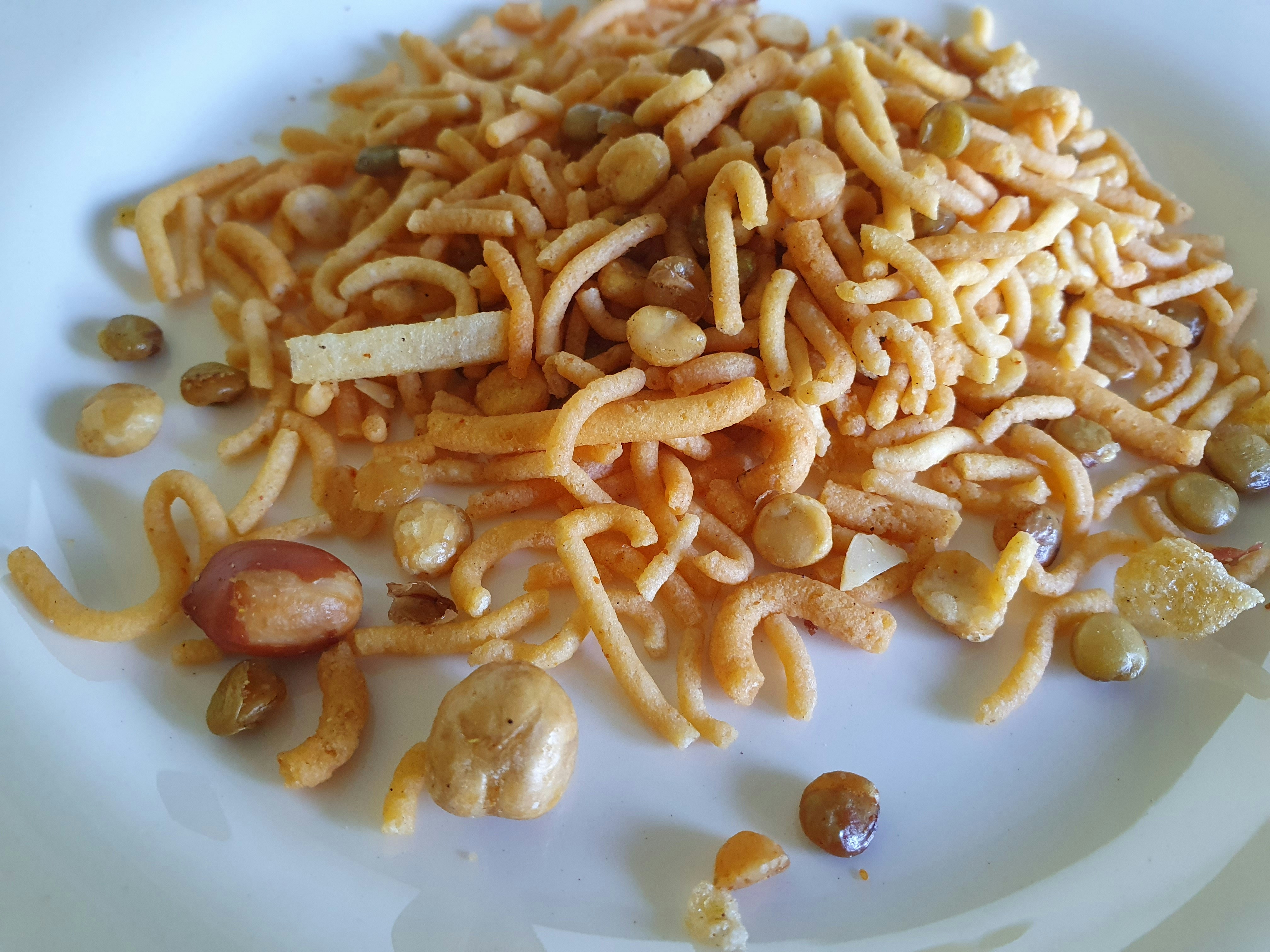 Traditional Indian farsan snack spread warm golden light