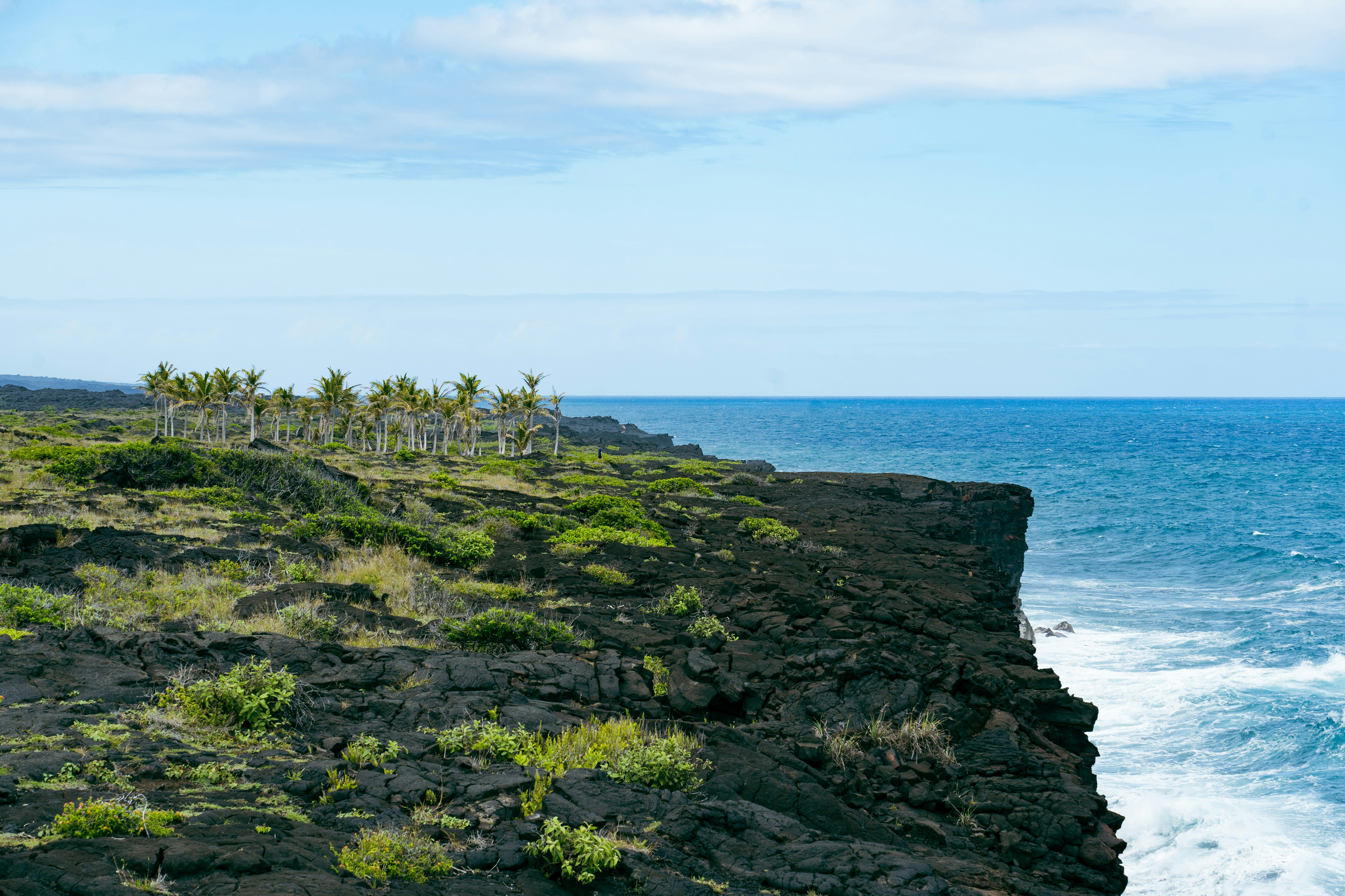 a view of the ocean from a rocky cliff