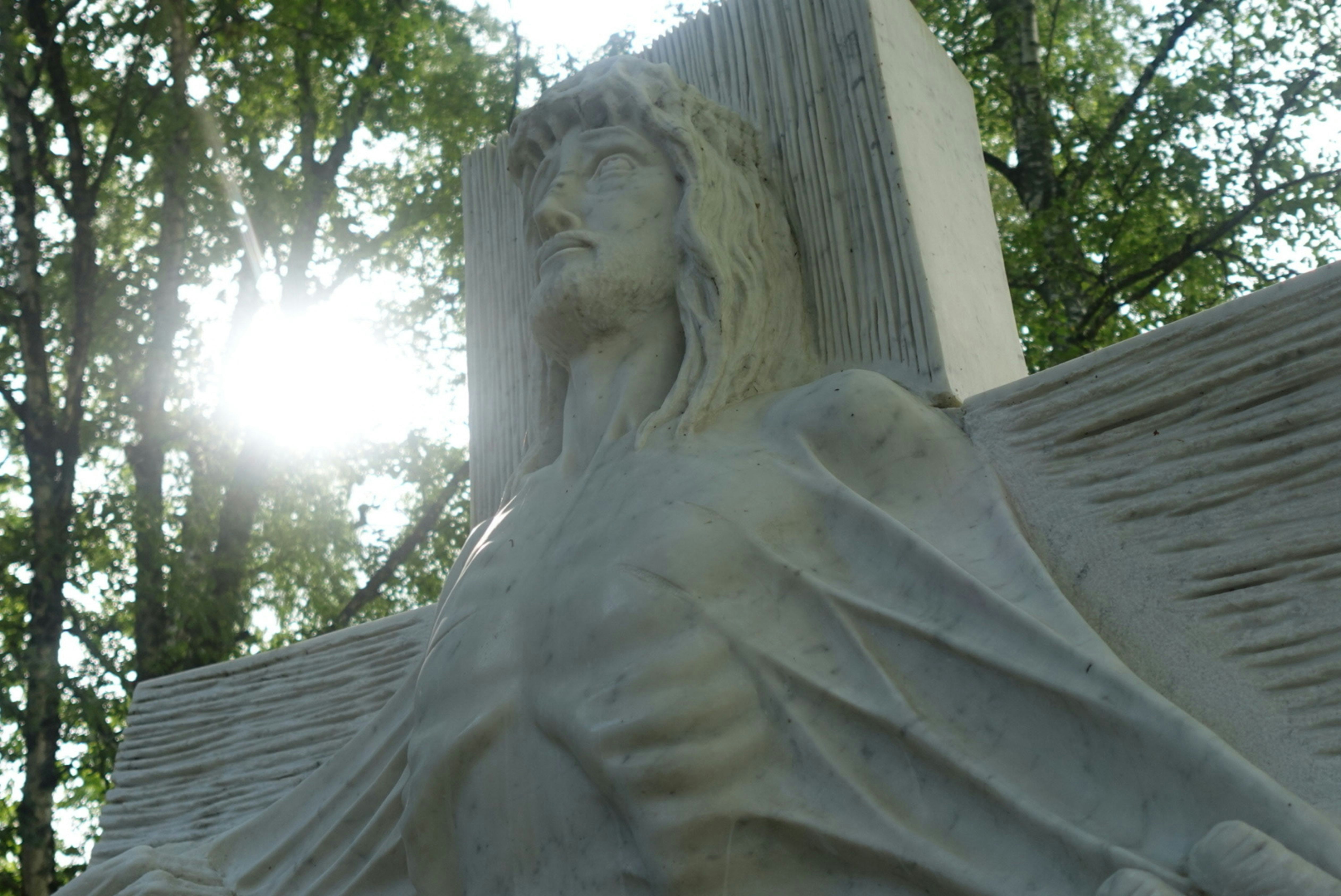 a statue of jesus on top of a building