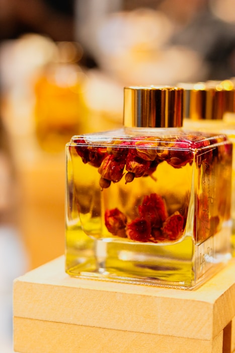 a close up of a bottle of perfume on a table