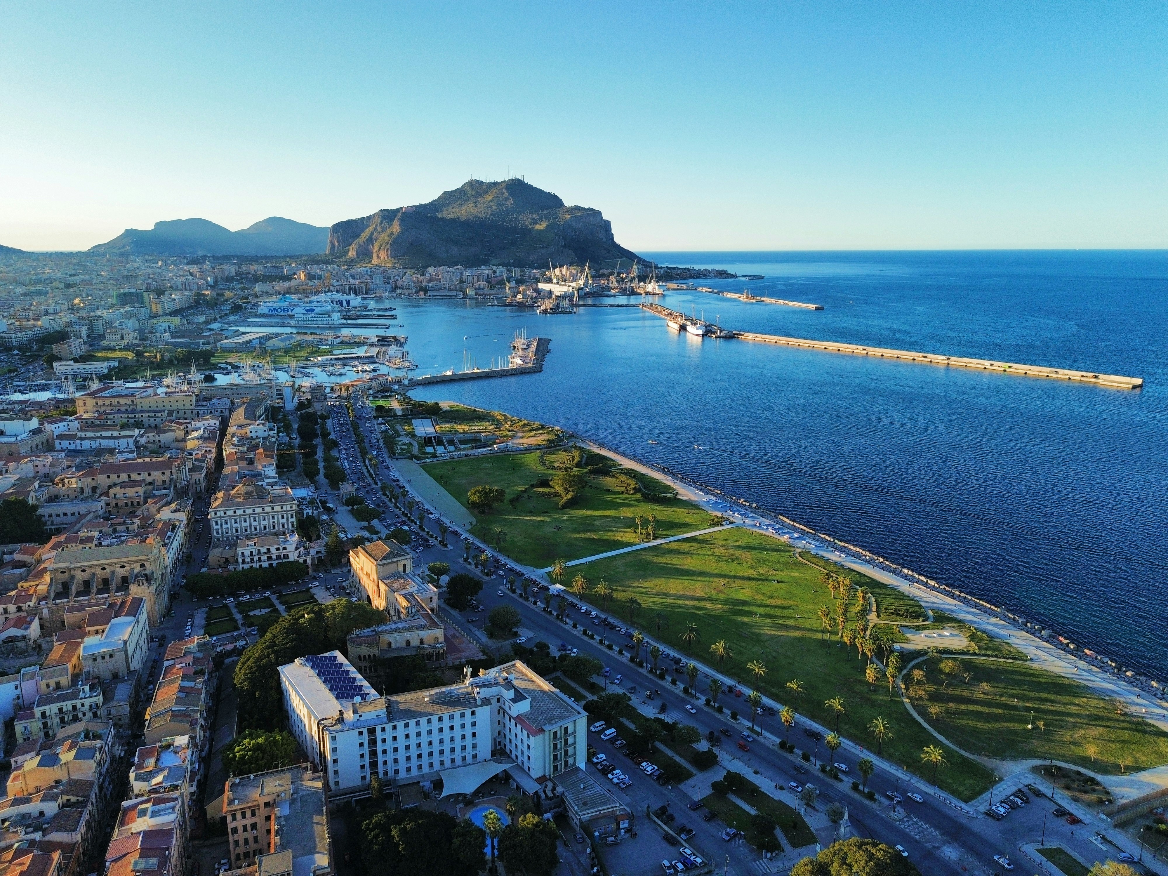 an aerial view of a city by the ocean