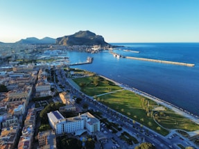 an aerial view of a city by the ocean