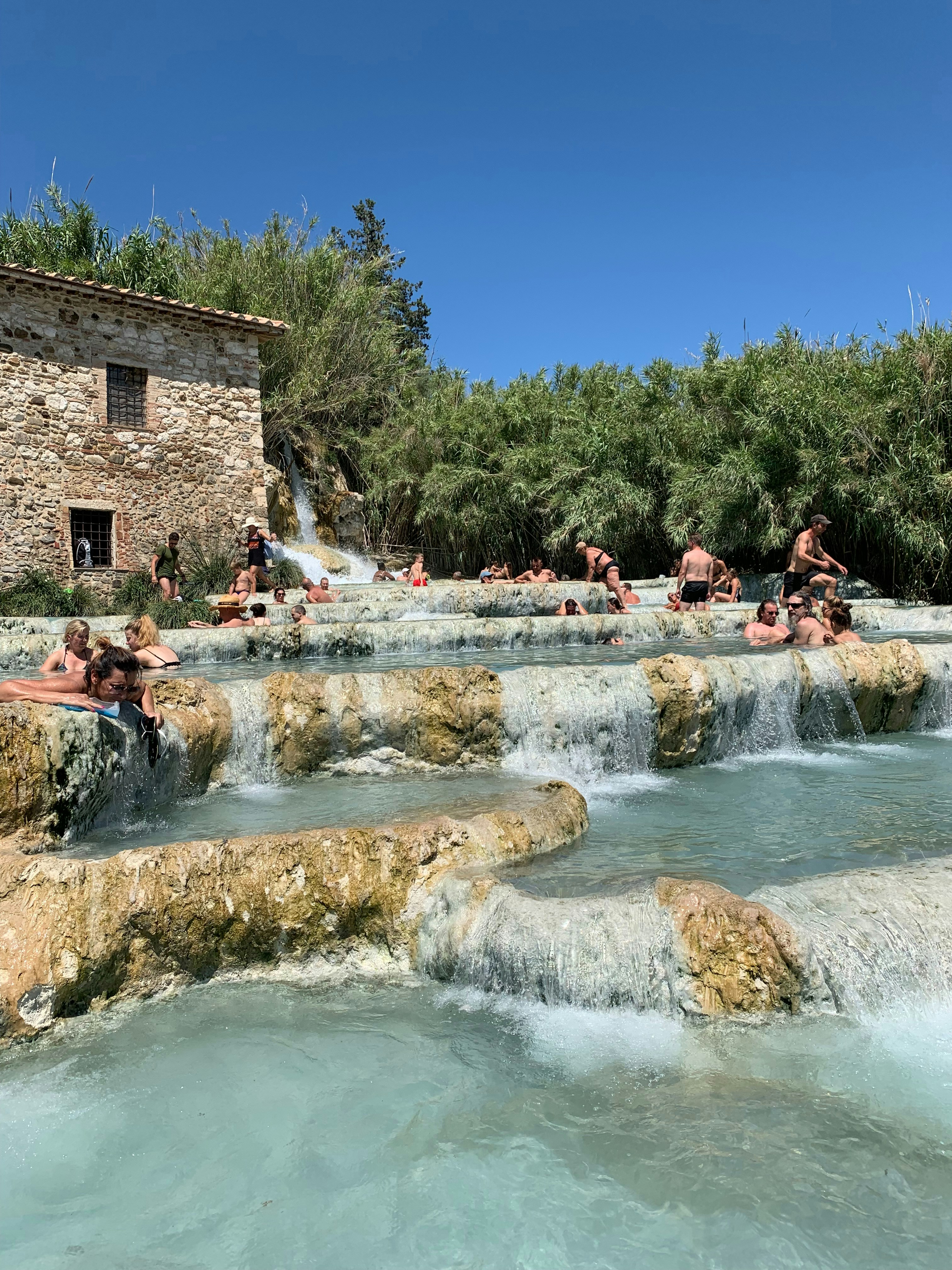 a group of people swimming in a pool of water