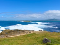 a view of the ocean from the top of a hill