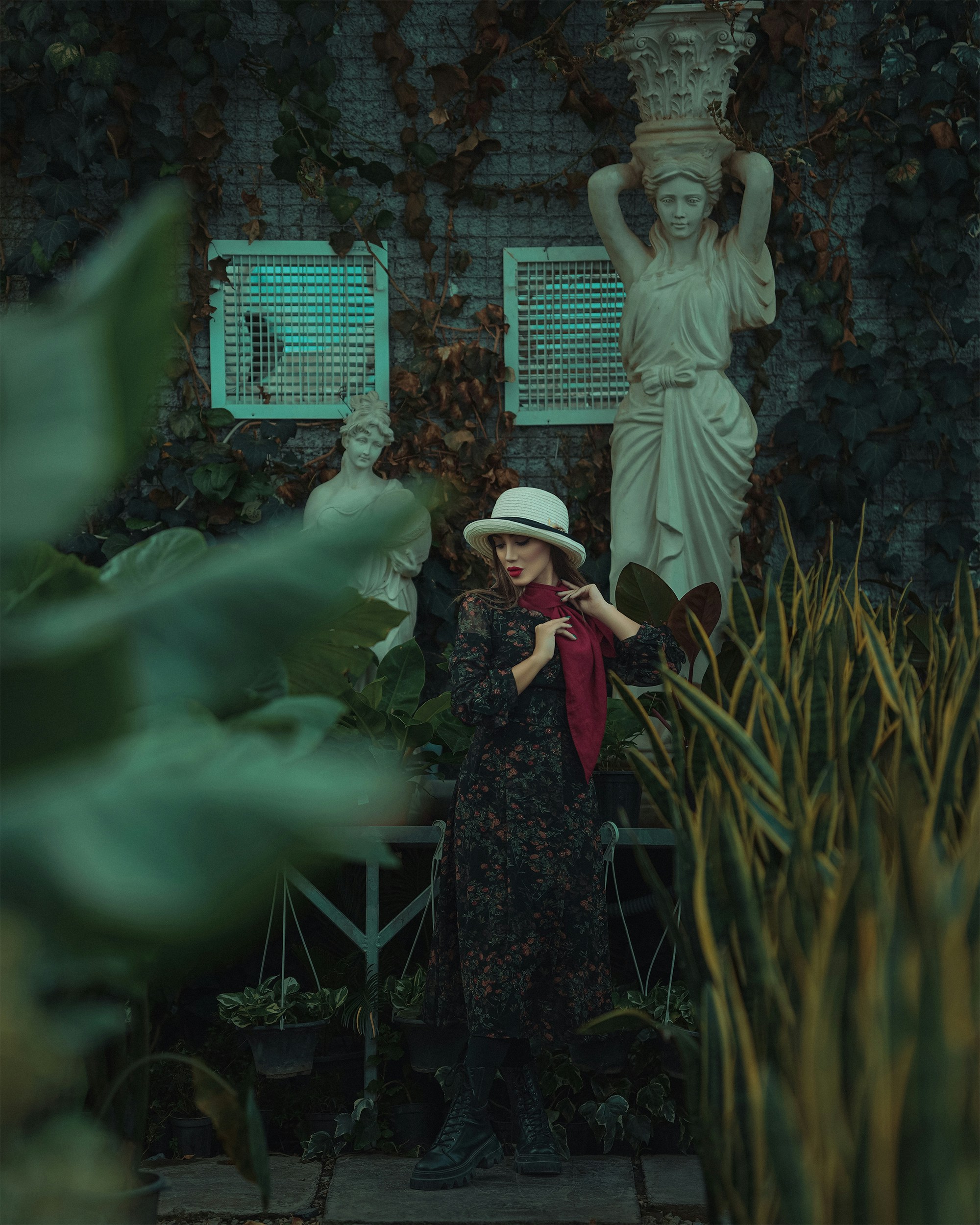 a woman standing in front of a statue
