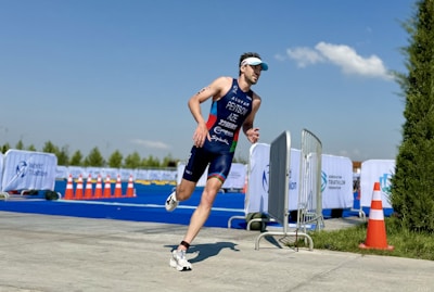 a man running in a race wearing a bib