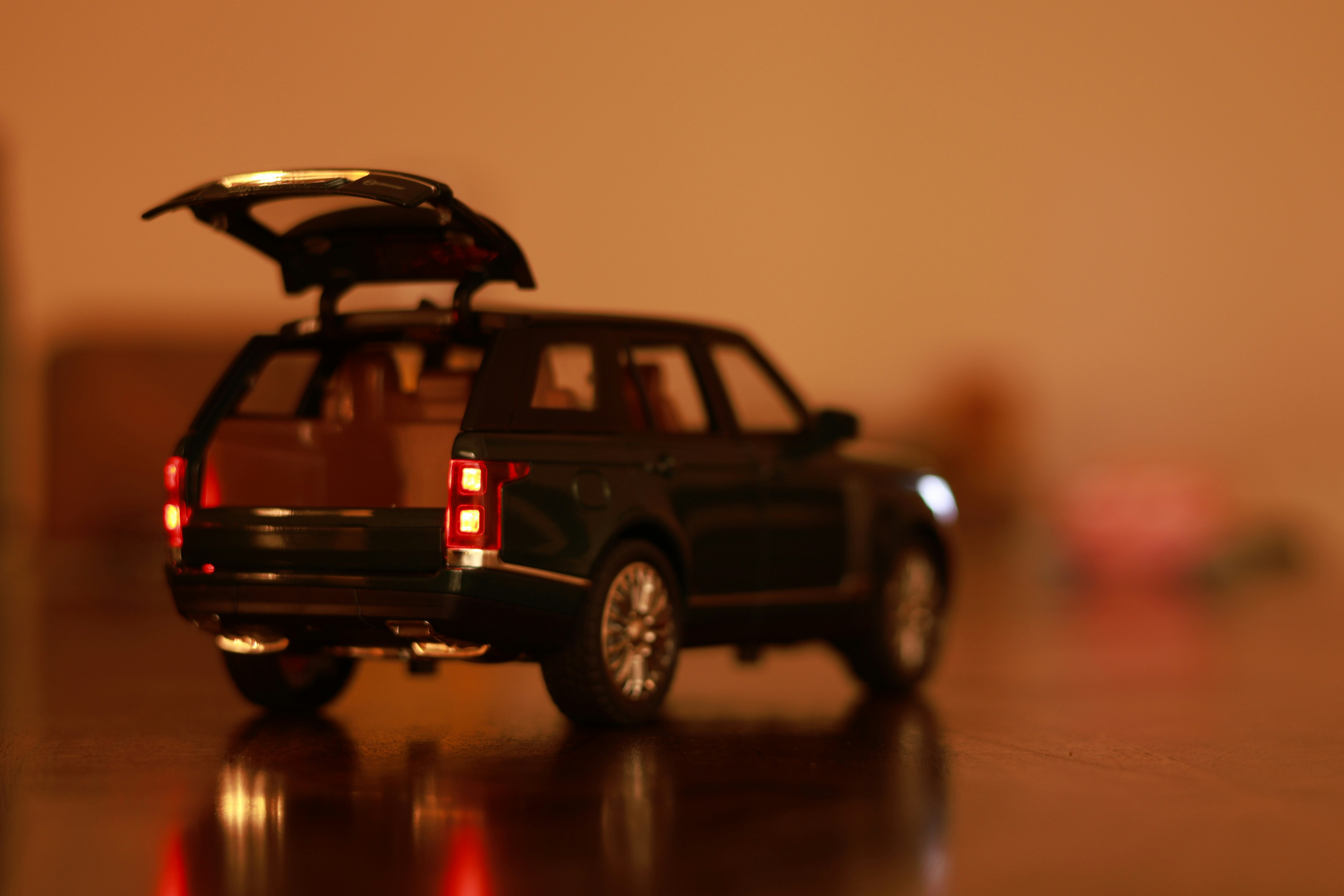a toy car with its trunk open on a table