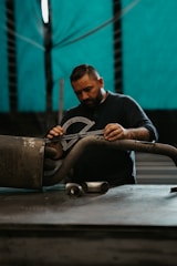 a man working on a piece of metal