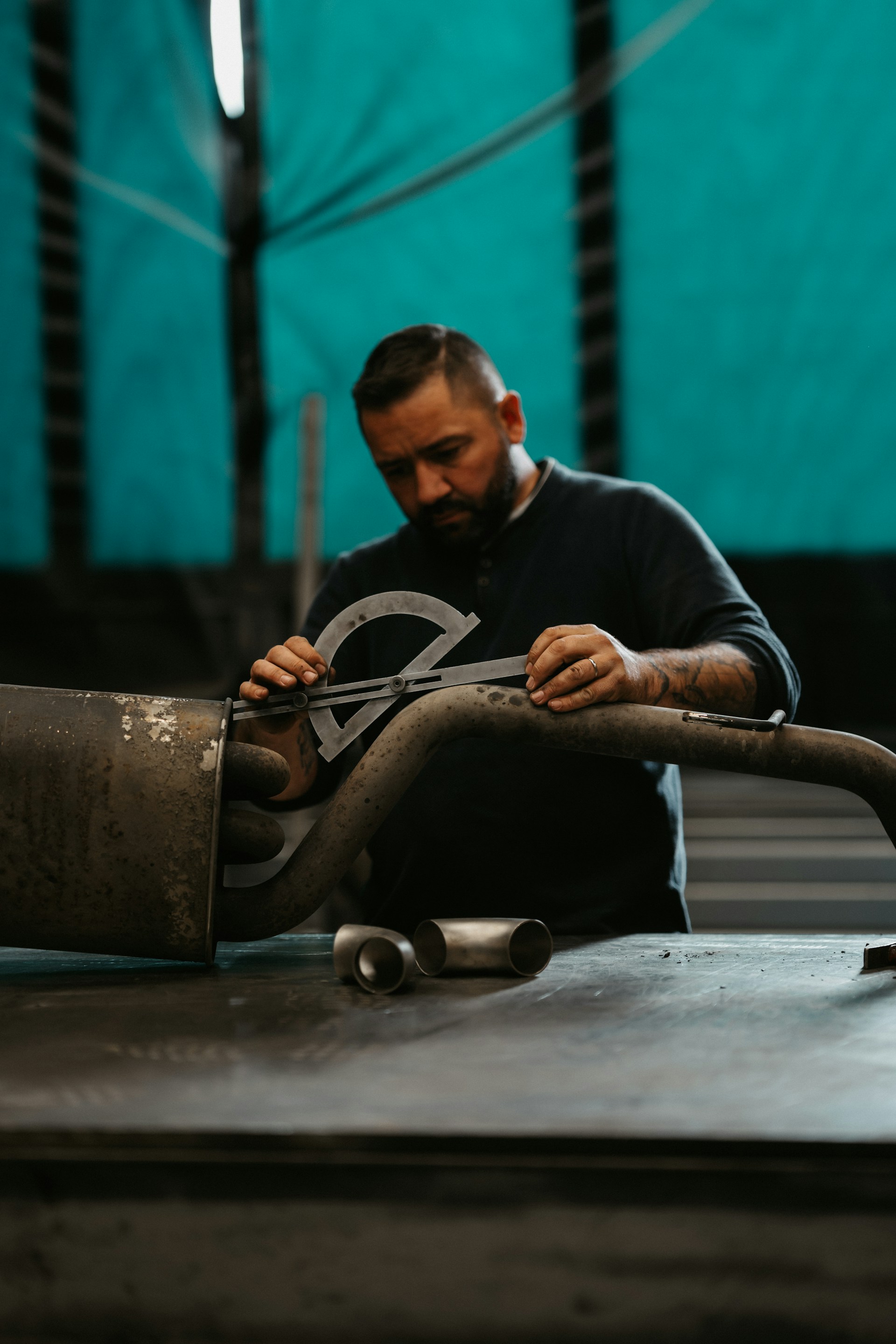 a man working on a piece of metal