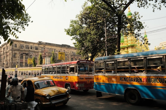 a couple of buses that are sitting in the street