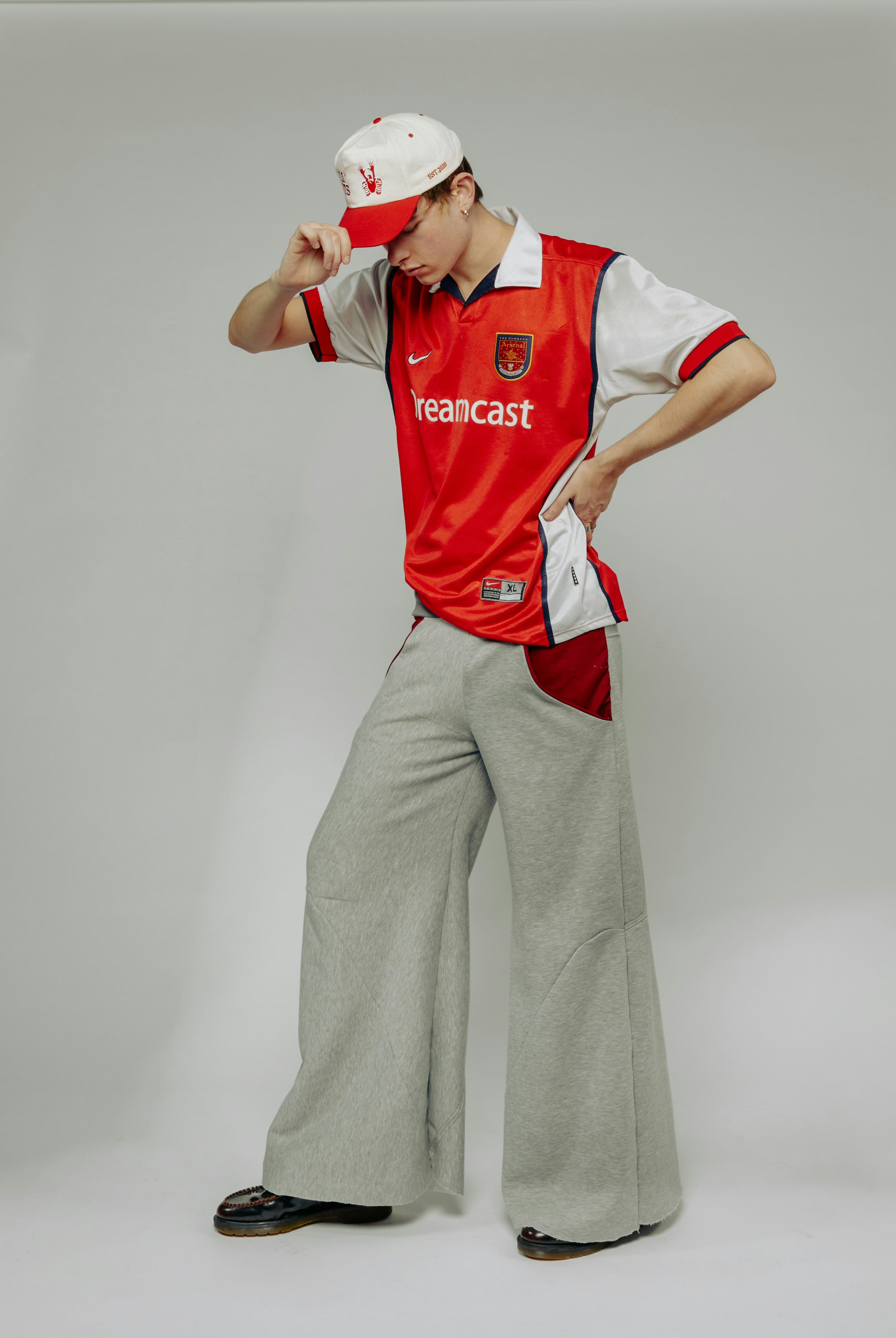A man in a red shirt and grey pants photo  Free Portrait Image on Unsplash
