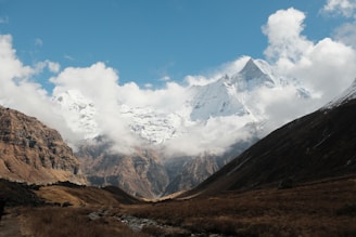 a mountain range with a stream running through it