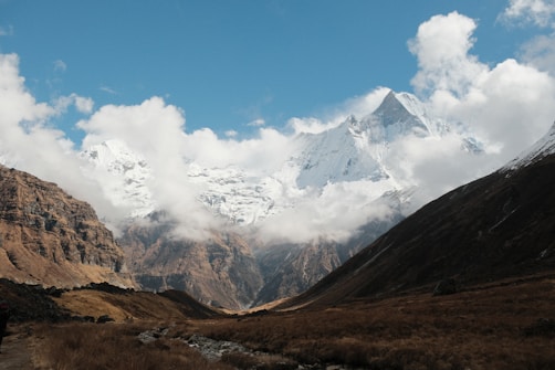 a mountain range with a stream running through it
