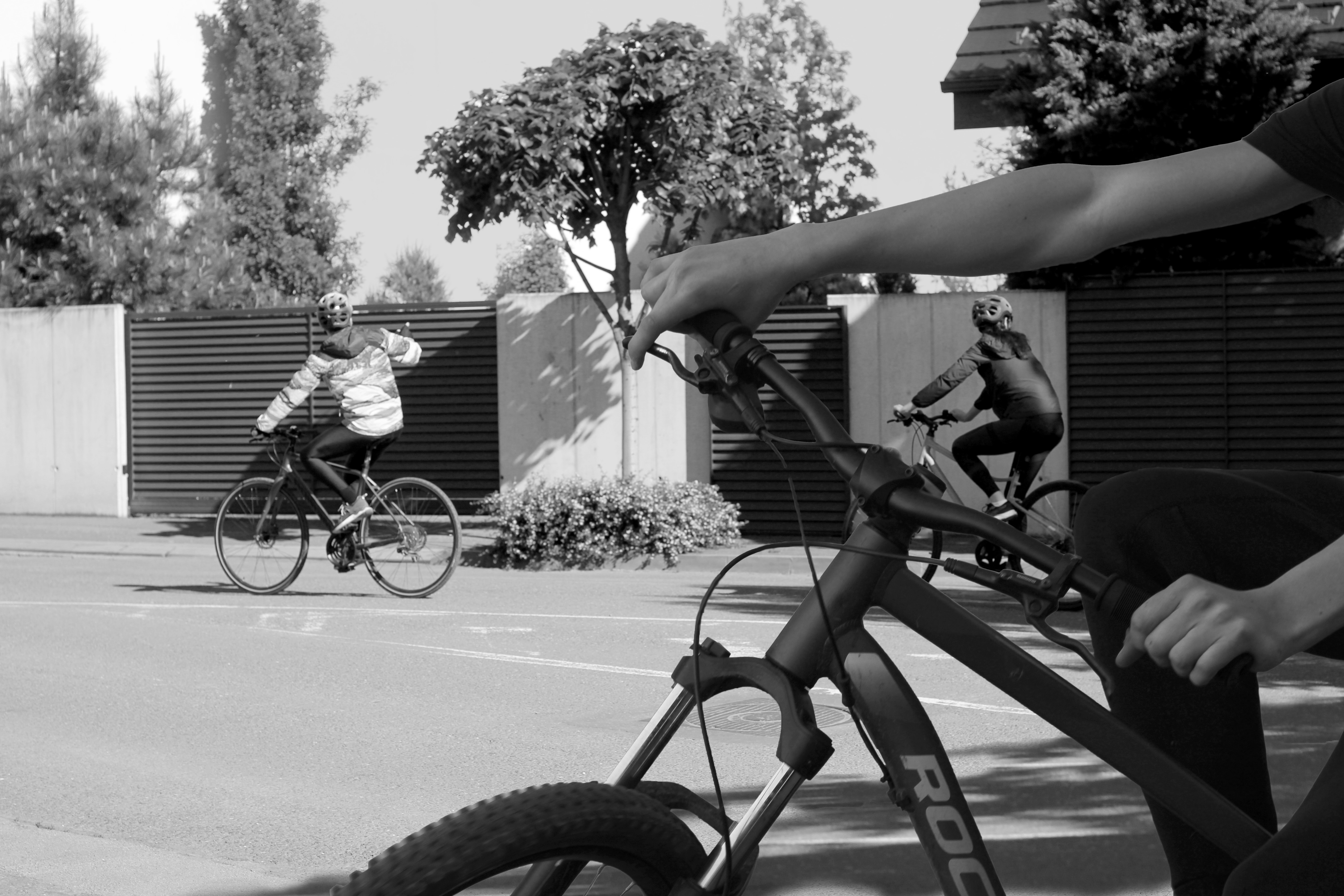 a person riding a bike on a city street