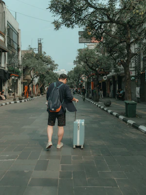 Traveler with suitcase exploring the city