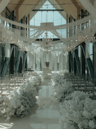 a large room with a bunch of chairs and a chandelier