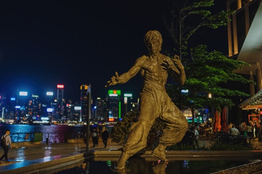 a statue of a woman dancing in the rain