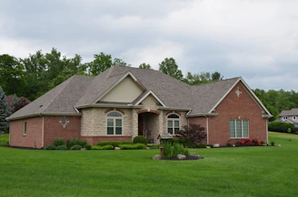 a house with a large lawn in front of it