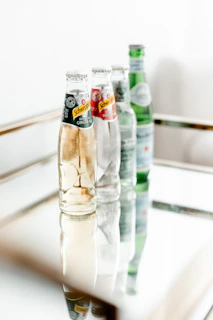 a row of empty bottles sitting on top of a table