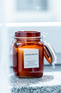a jar filled with liquid sitting on top of a counter
