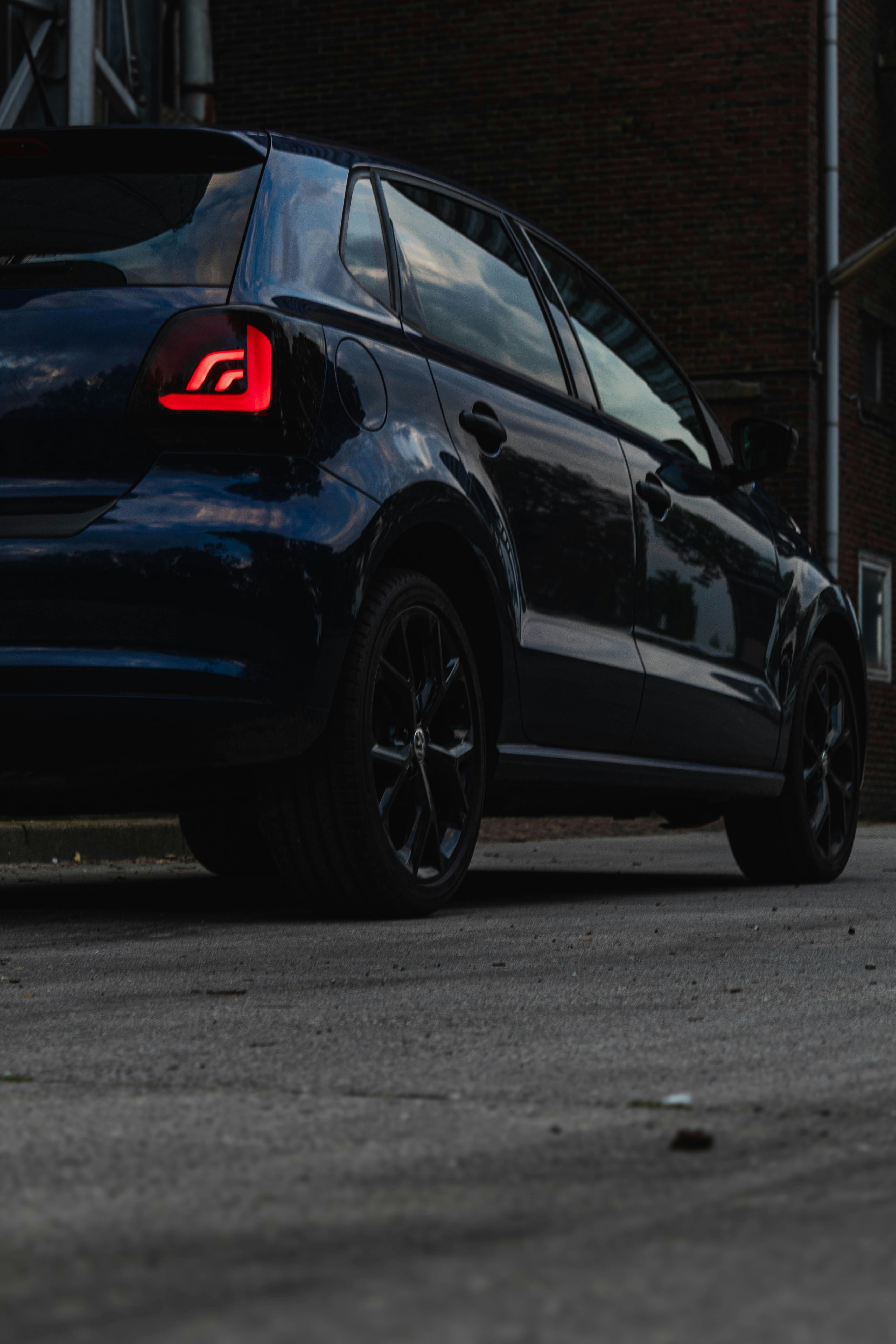 a blue car parked on the side of the road
