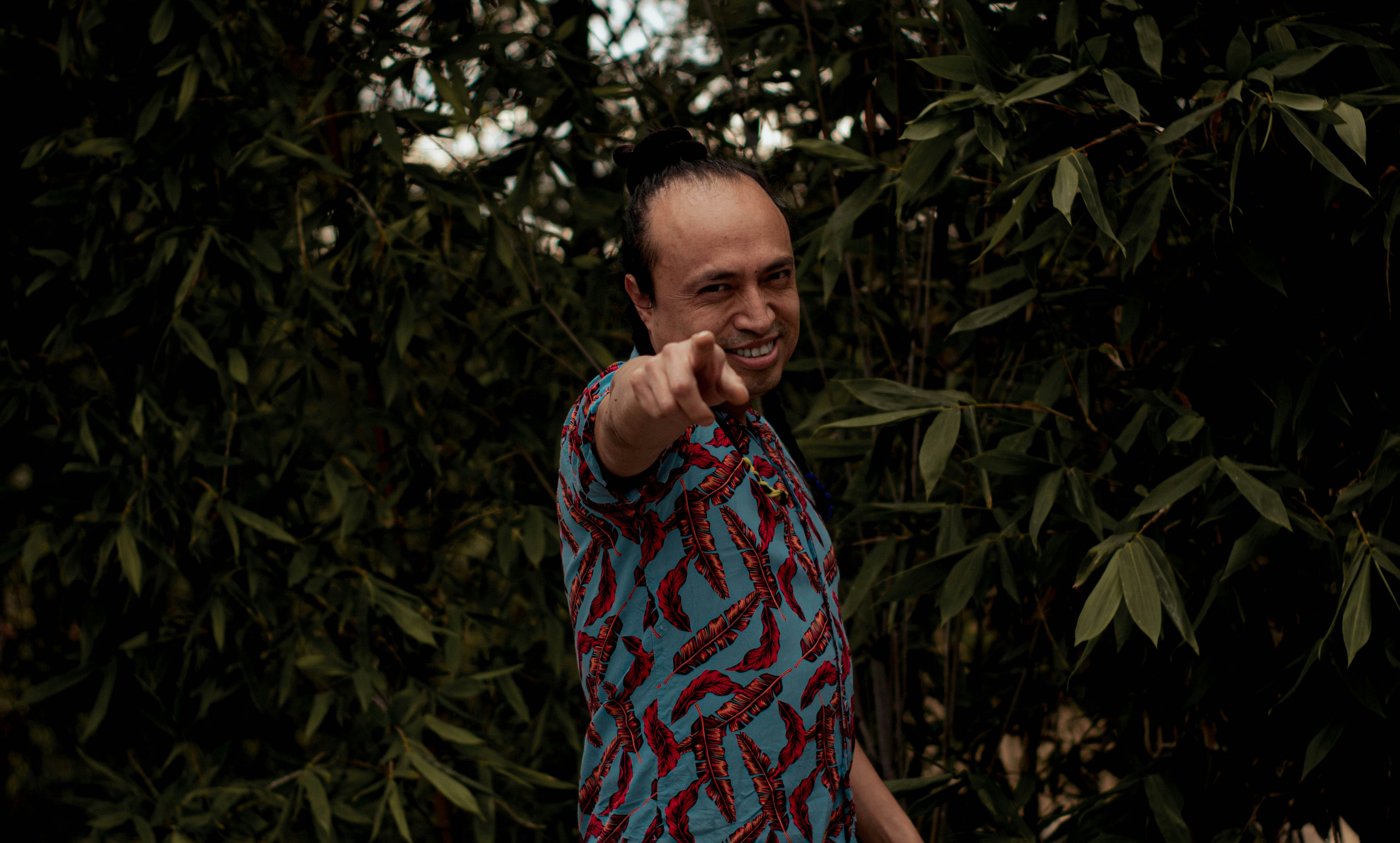 a man pointing a gun at the camera