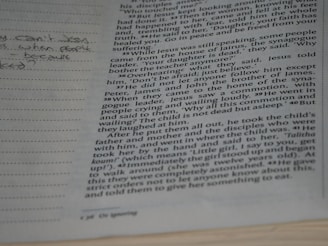 a close up of a book with writing on it